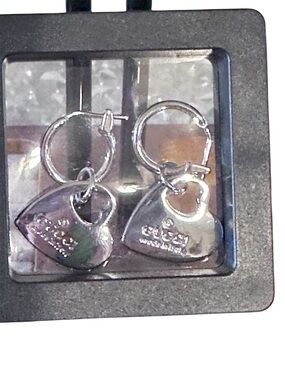 Upcycled authentic Gucci zipper pulls on 925 SS huggie hoops.